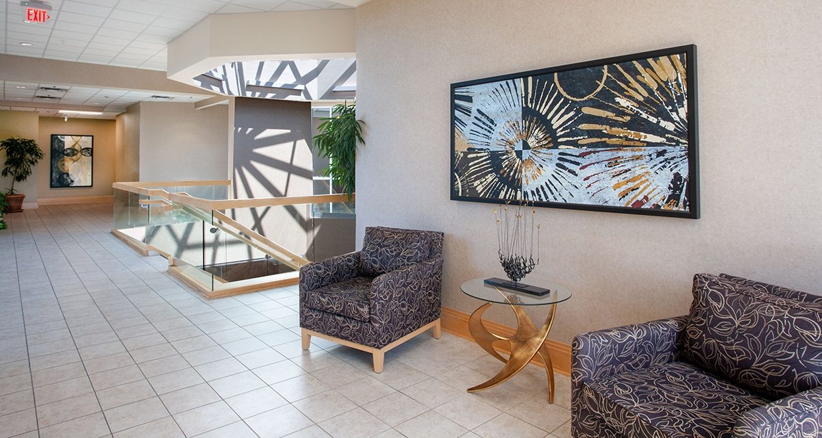 2nd floor common area with chairs and staircase