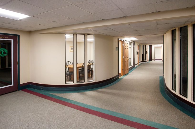 Hallway with access to multiple conference rooms