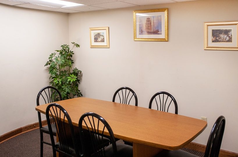 Conference room with a plant and pictures on the wall