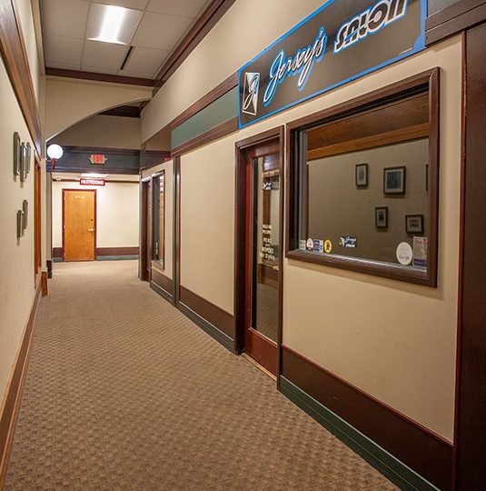 Howard Court hallway with a sign that says Jersey's Salon